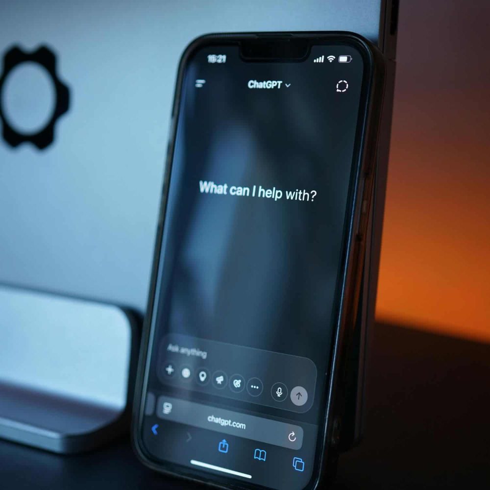Smartphone displaying ChatGPT AI assistant for online training.