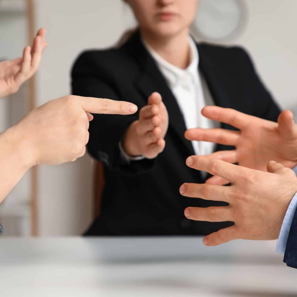 People involved in a workplace conflict resolution discussion.