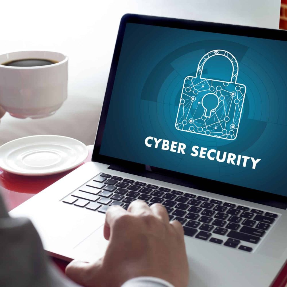 Laptop screen displaying cyber security lock icon for online training.