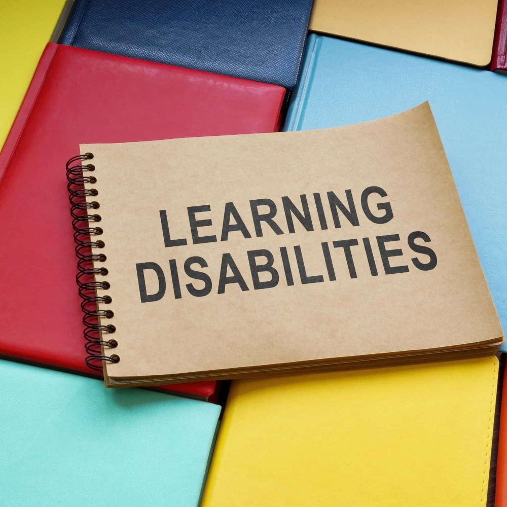 Book titled Learning Disabilities on colorful notebooks.