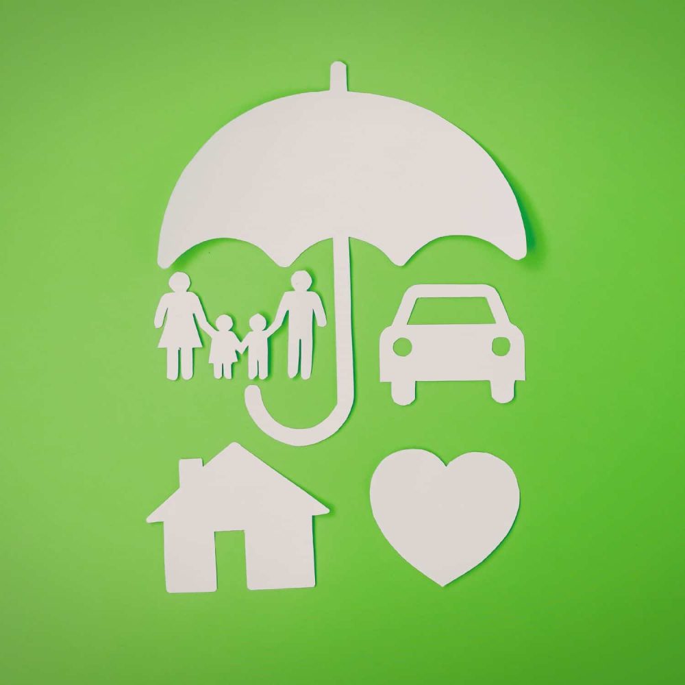 Family under umbrella with car, house, and heart symbols on green background.