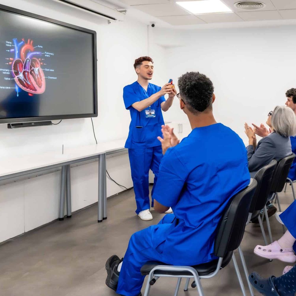 Healthcare professional giving a presentation in a classroom setting.