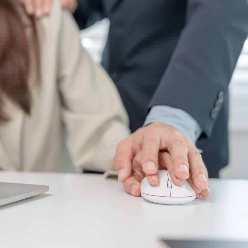 Business professional using a computer mouse during training session.